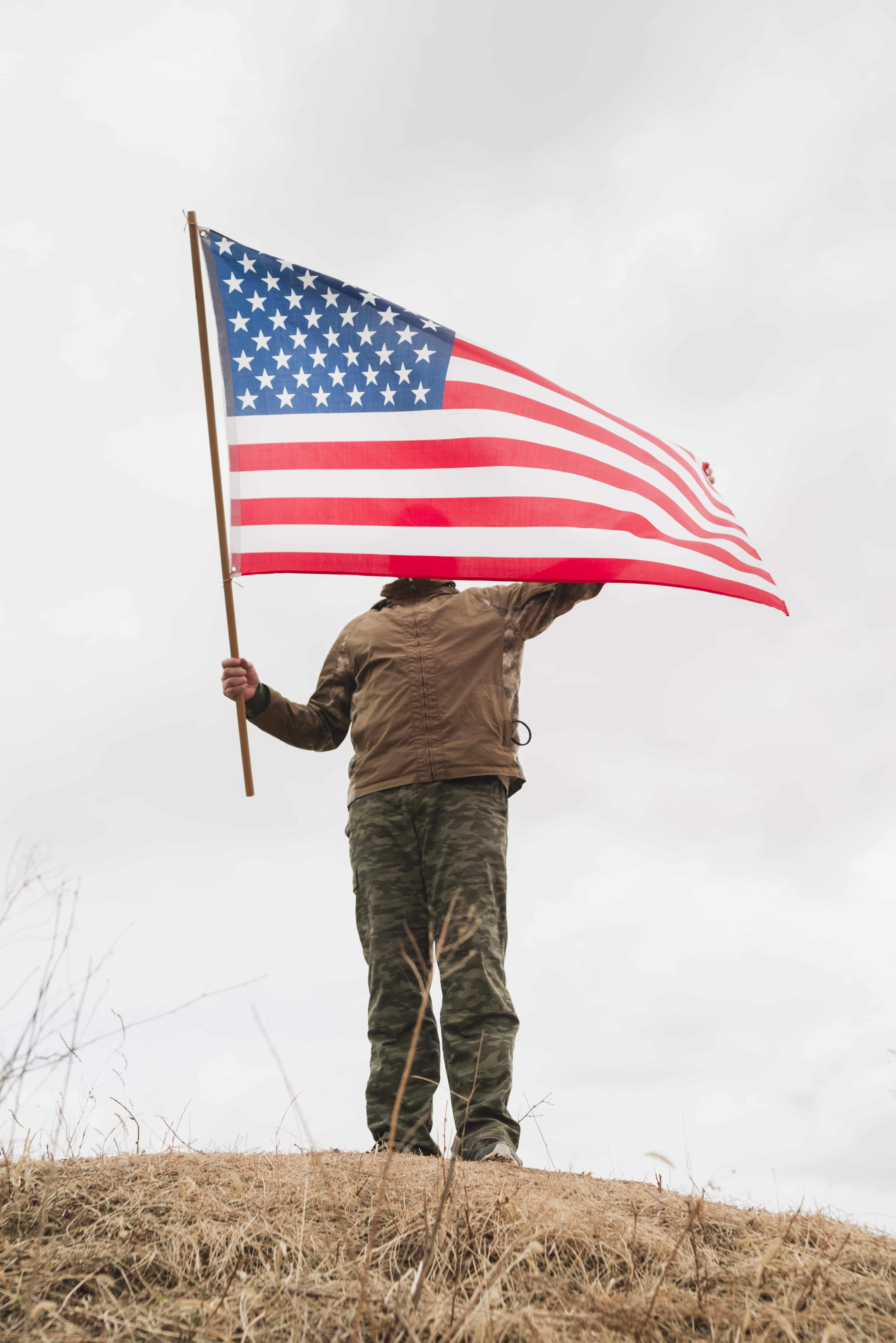 person-with-american-flag-hill